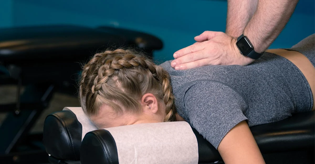 Patient receiving chiropractic adjustment to improve spinal alignment and overall wellness
