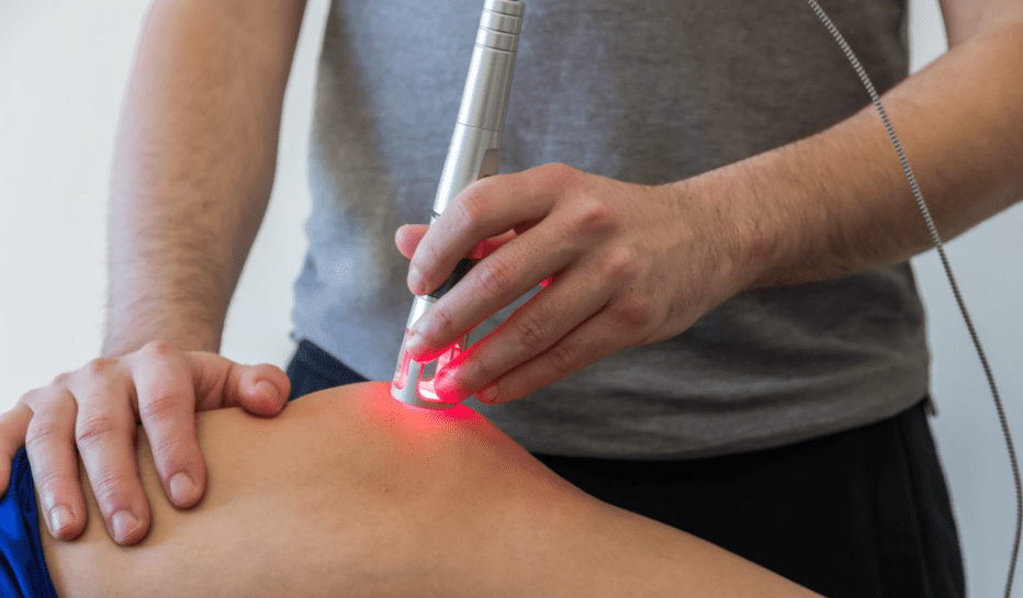 Class IV laser therapy treatment being performed to support pain relief and tissue healing